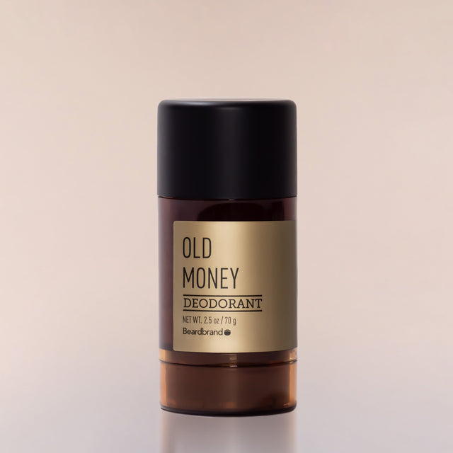 A round tube of Beardbrand Old Money Deodorant against a neutral background.