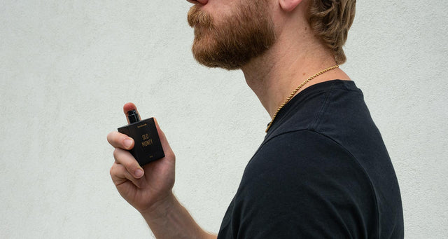 Eric Bandholz applying Old Money Eau de Parfum by Beardbrand. 